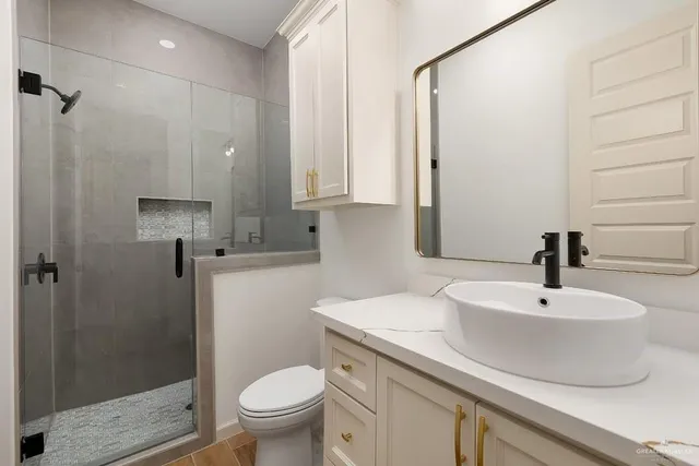 a bathroom with a sink double vanity and a mirror