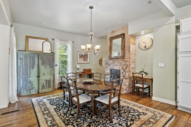 a view of living room with furniture and large window