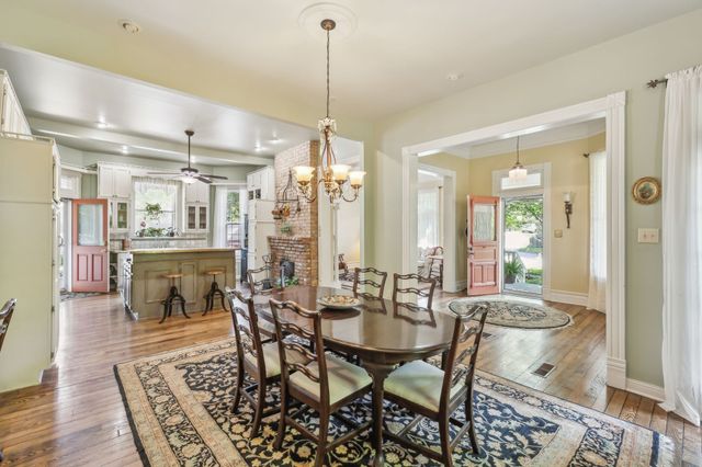 a bathroom with a sink mirror and a shower
