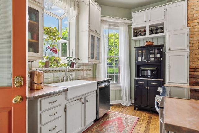 a bedroom with furniture and a fireplace