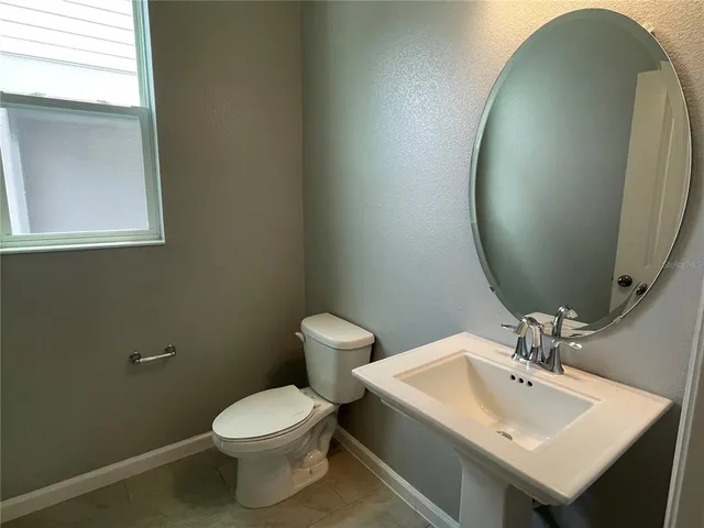 a bathroom with a sink and cabinets