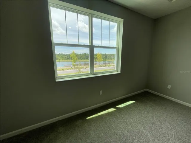 a view of empty room with windows