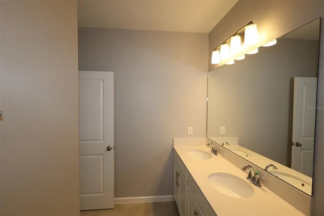 a view of a house with a yard and a garage