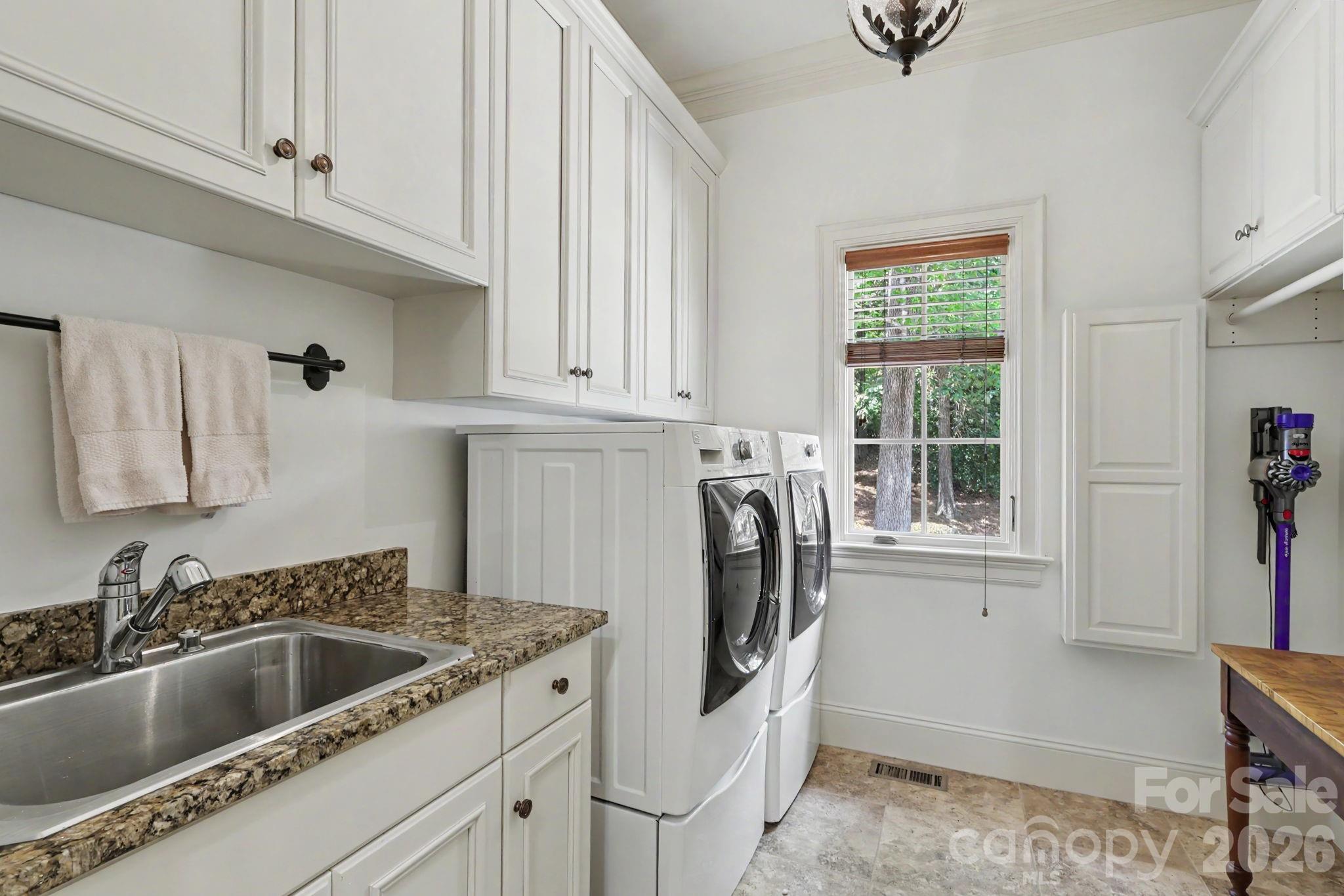 508 Hideaway Ridge Court Matthews, NC 28105 - Photo 26 of 47 a kitchen with a white cabinets and a sink