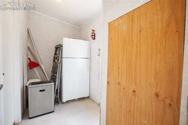 a white refrigerator freezer and a dishwasher sitting in a kitchen