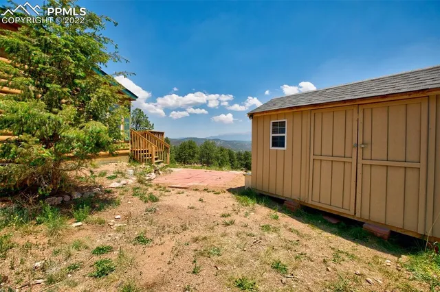 a view of a backyard of the house