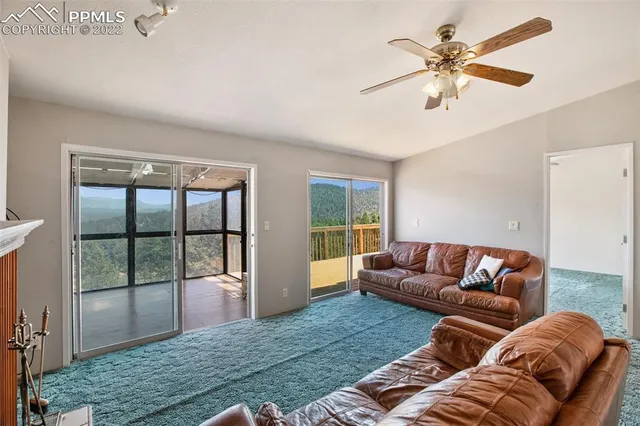a living room with a couch and a large window