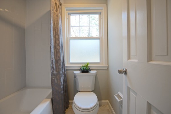 82 Herrick Road Boxford, MA 01921 - Photo 15 of 25 a white toilet sitting next to a bathroom sink