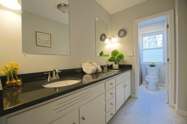 82 Herrick Road Boxford, MA 01921 - Photo 17 of 25 a bathroom with a granite countertop sink mirror and toilet