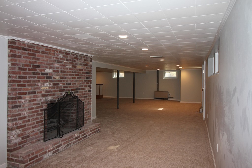 82 Herrick Road Boxford, MA 01921 - Photo 19 of 25 a view of empty room with a fireplace
