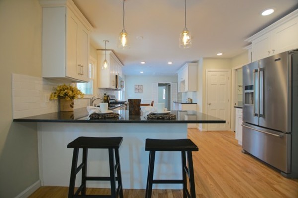 82 Herrick Road Boxford, MA 01921 - Photo 3 of 25 a kitchen with refrigerator and cabinets
