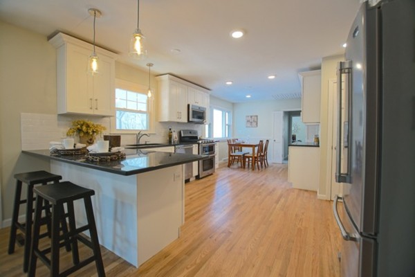 82 Herrick Road Boxford, MA 01921 - Photo 4 of 25 a kitchen with counter top space a sink appliances and cabinets