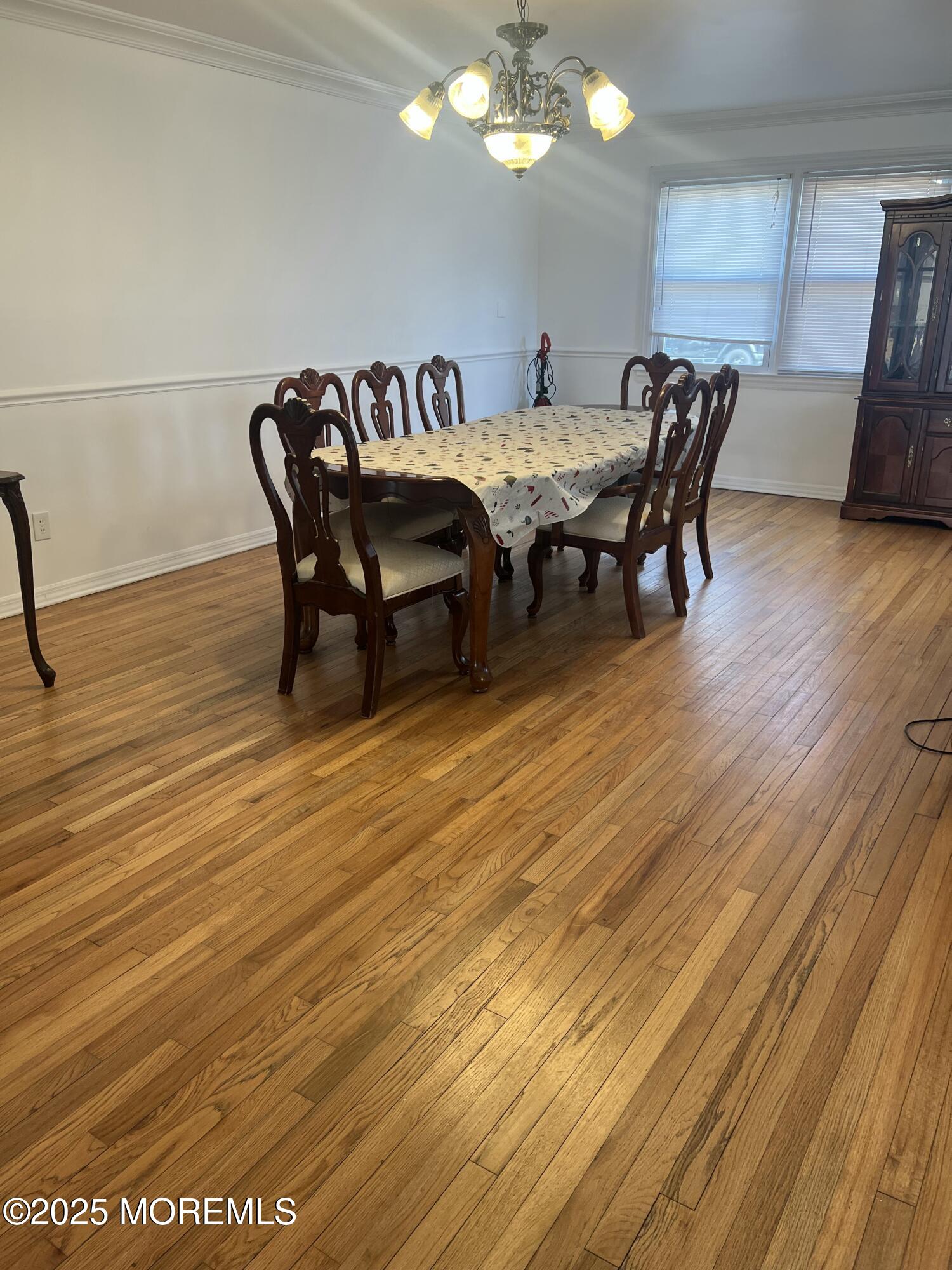 402 Deal Road Asbury Park, NJ 07712 - Photo 4 of 8 a dining room with furniture and wooden floor