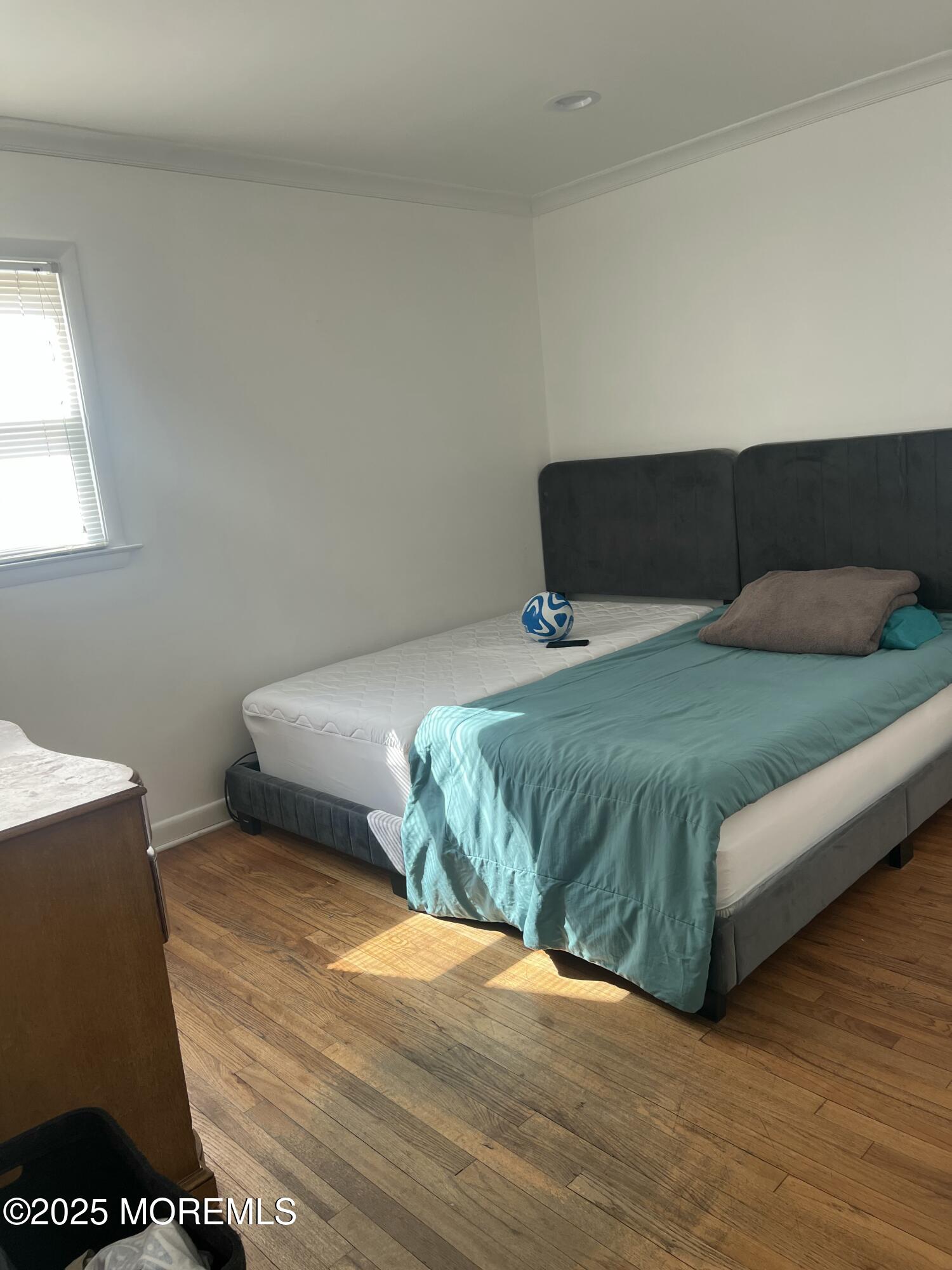 402 Deal Road Asbury Park, NJ 07712 - Photo 7 of 8 a bedroom with a bed and window