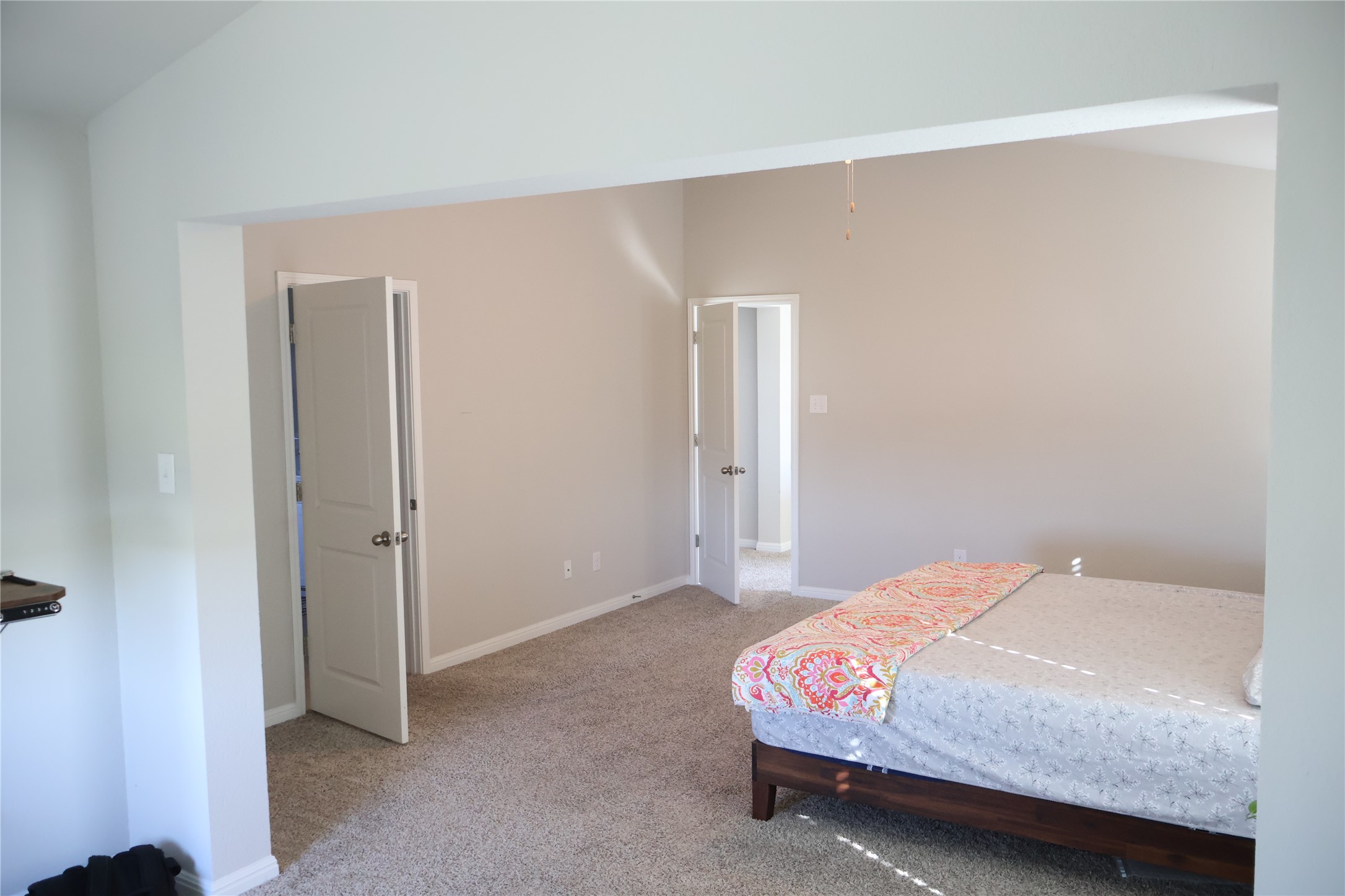 11500 Maple Leaf Way Manor, TX 78653 - Photo 15 of 29 Bedroom featuring light carpet and baseboards