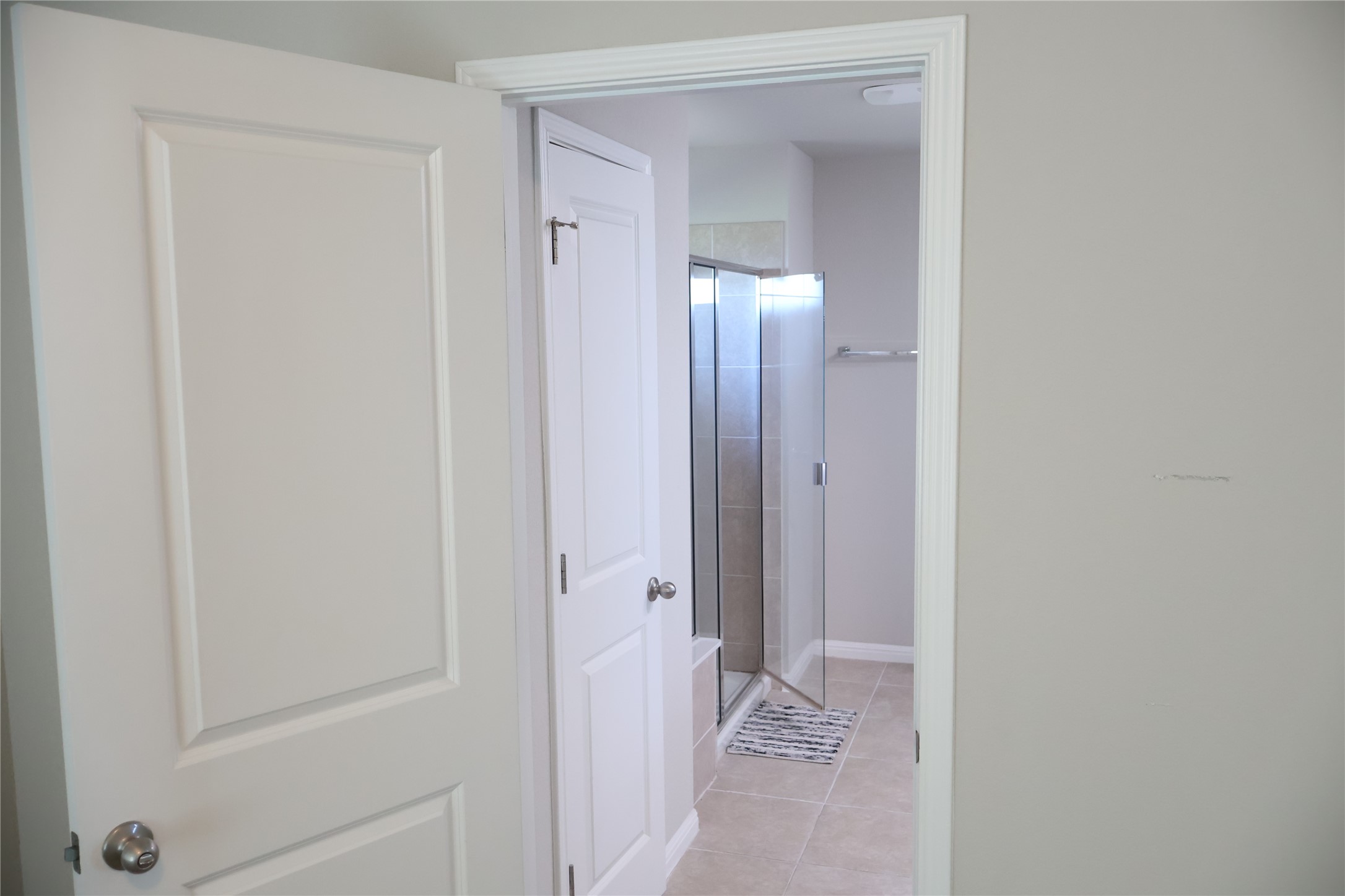11500 Maple Leaf Way Manor, TX 78653 - Photo 17 of 29 Corridor with light tile patterned flooring and baseboards