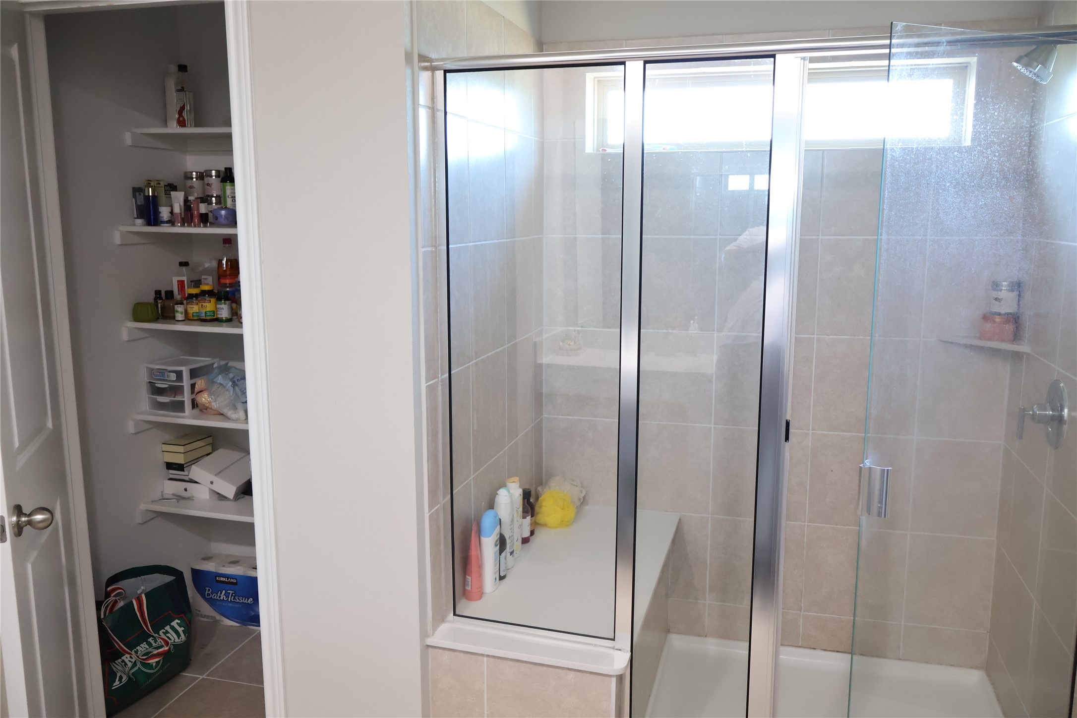 11500 Maple Leaf Way Manor, TX 78653 - Photo 22 of 29 Full bathroom featuring a shower stall and light tile patterned floors