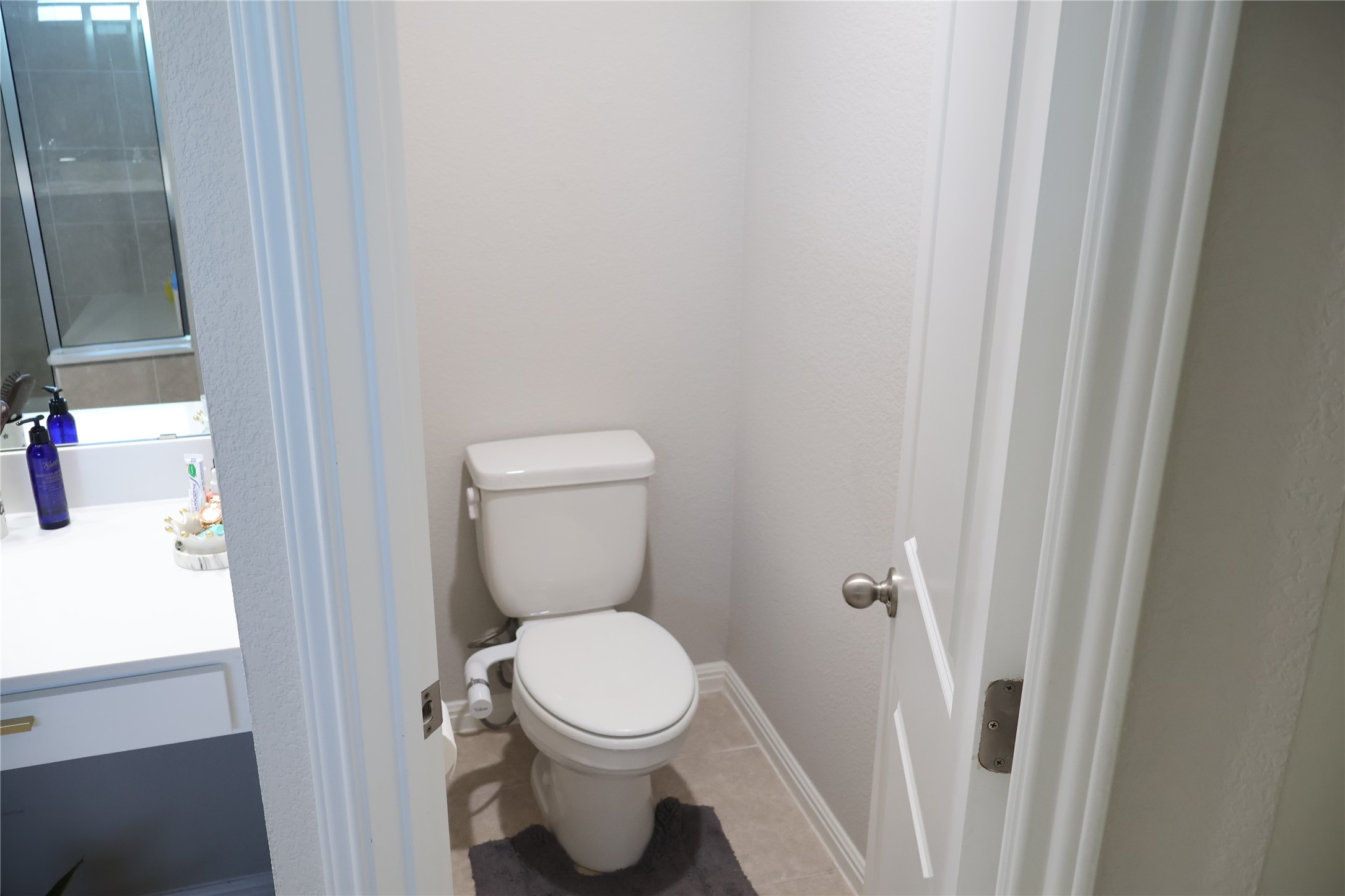 11500 Maple Leaf Way Manor, TX 78653 - Photo 23 of 29 Bathroom featuring vanity and light tile patterned floors