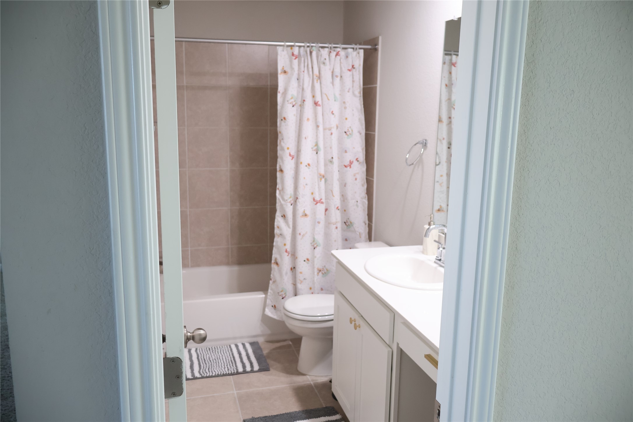 11500 Maple Leaf Way Manor, TX 78653 - Photo 25 of 29 Full bath with vanity, shower / tub combo, and light tile patterned floors