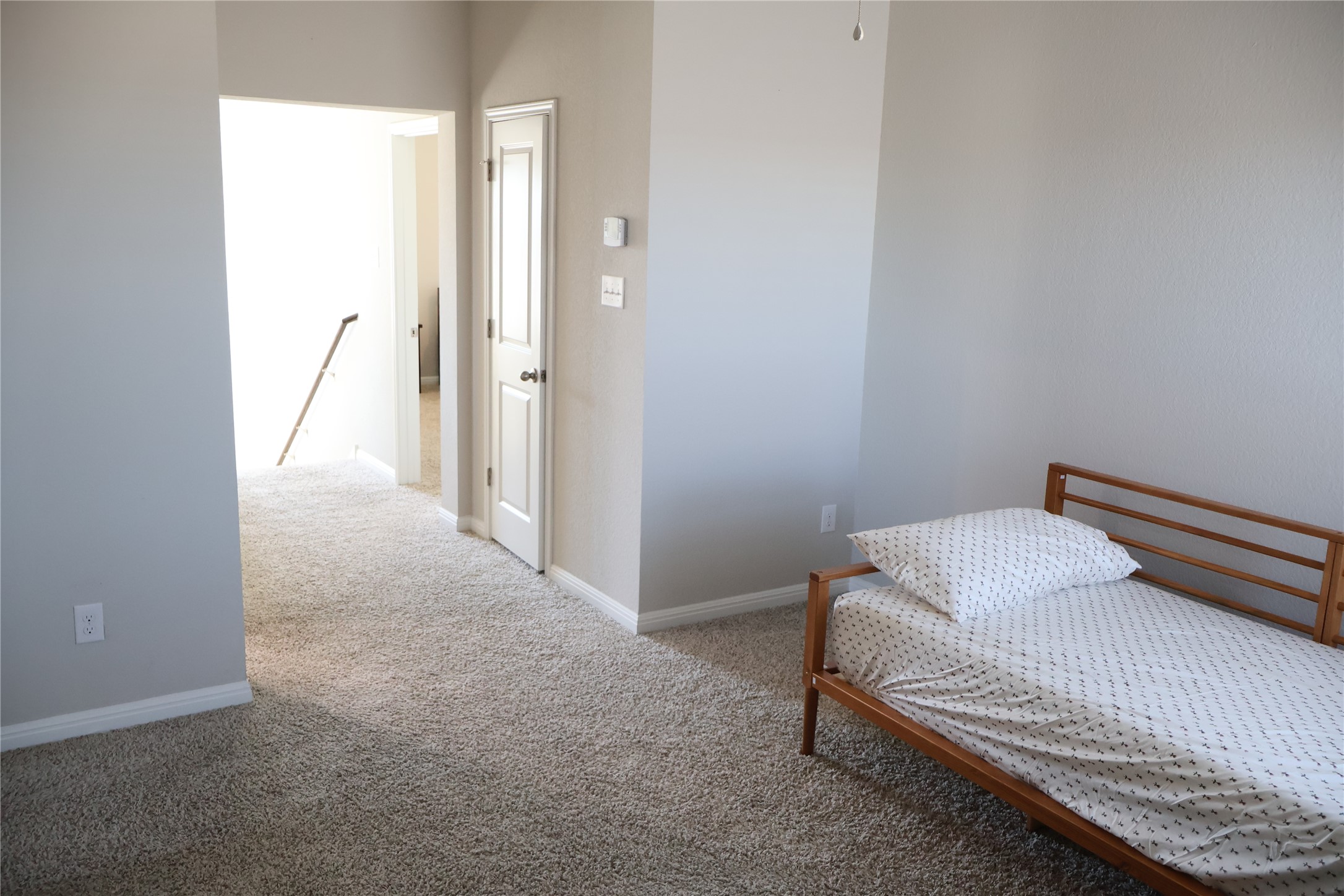 11500 Maple Leaf Way Manor, TX 78653 - Photo 26 of 29 Bedroom featuring light colored carpet and baseboards