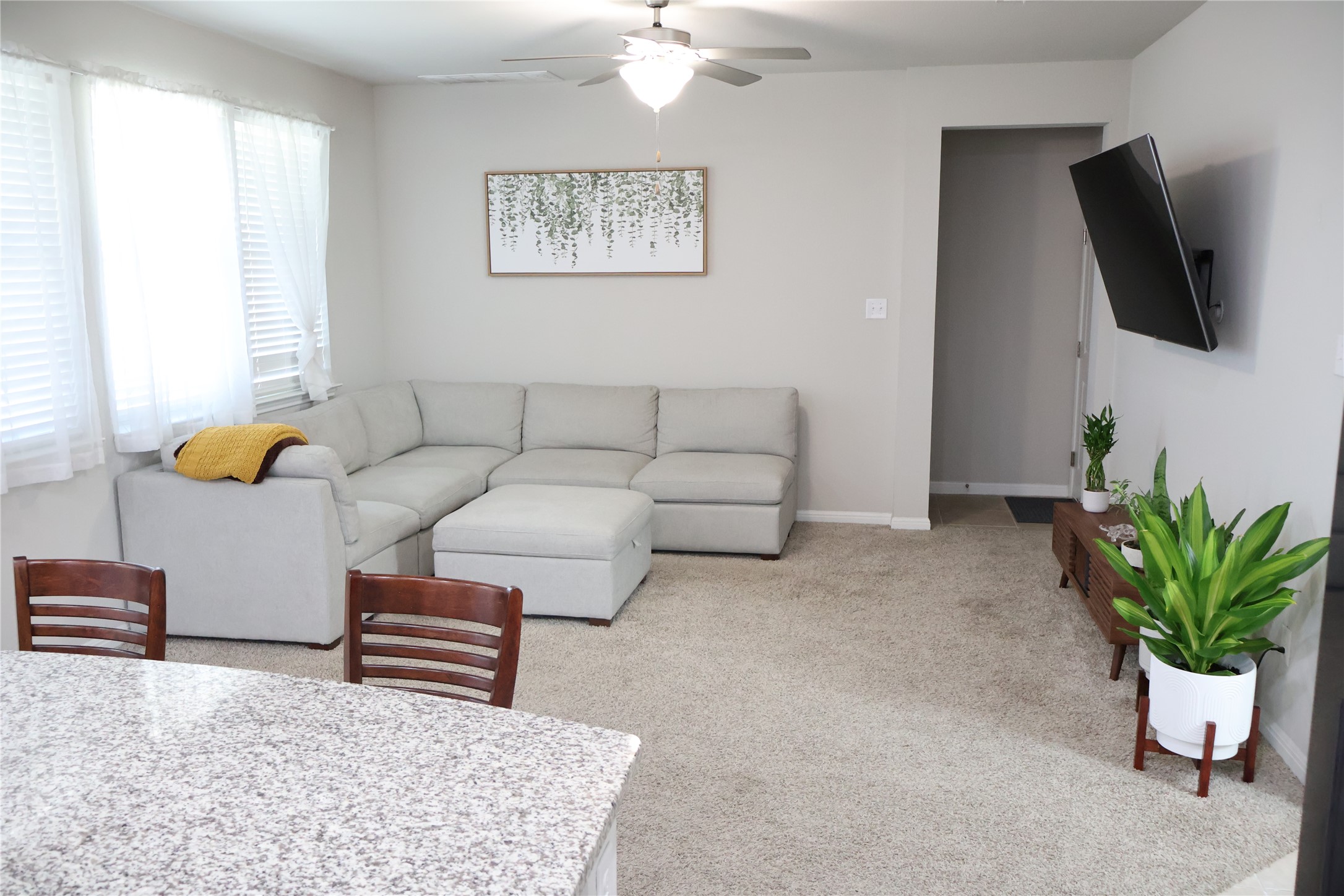 11500 Maple Leaf Way Manor, TX 78653 - Photo 6 of 29 Living room featuring light colored carpet and ceiling fan