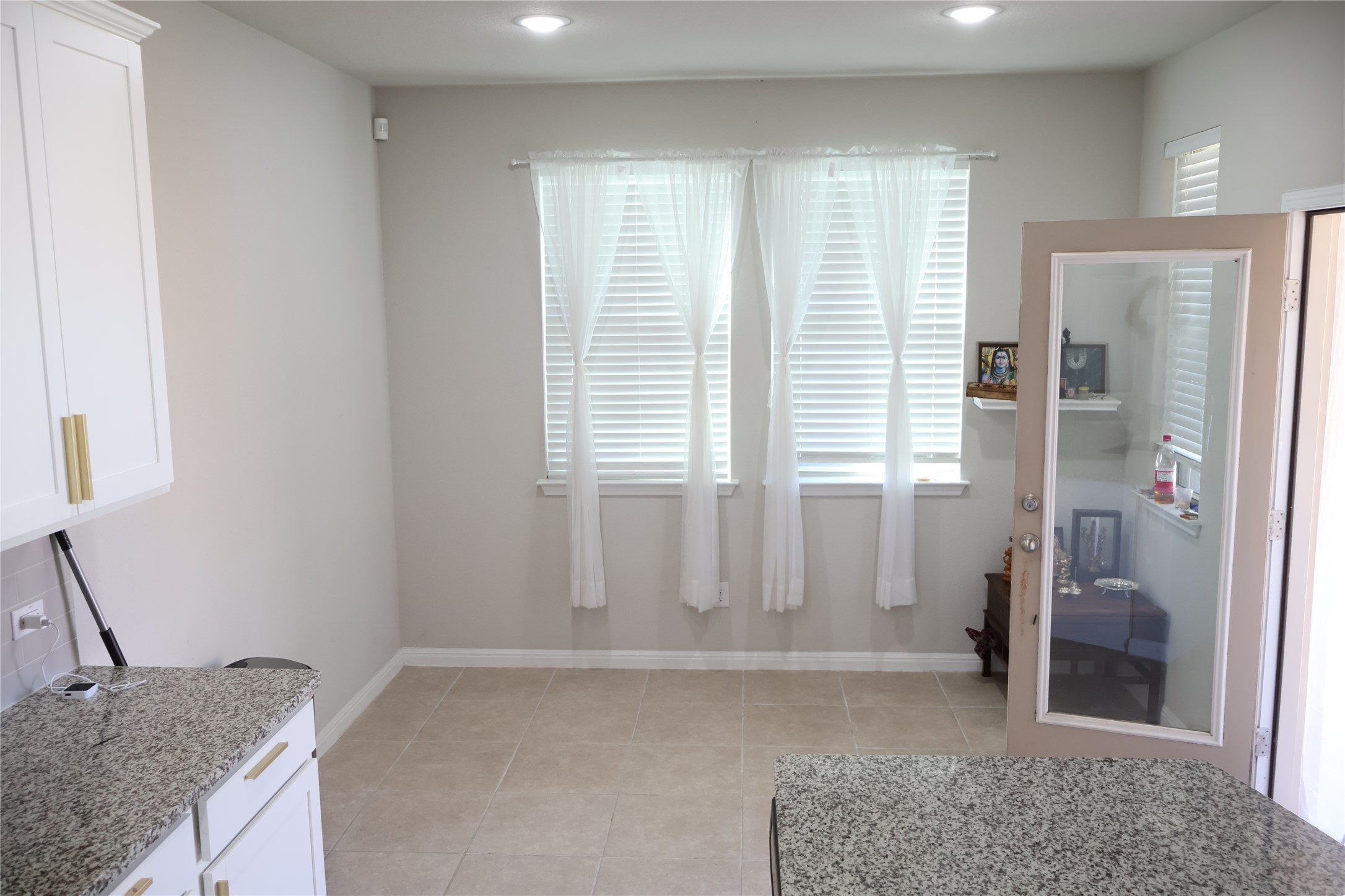11500 Maple Leaf Way Manor, TX 78653 - Photo 8 of 29 Dining space with healthy amount of natural light and light tile patterned flooring