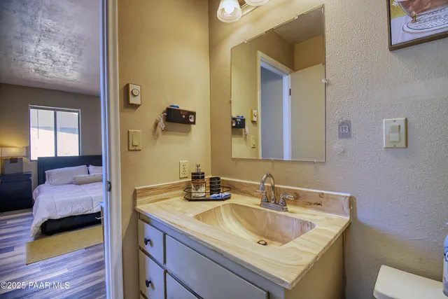 a en suite bathroom with a sink and a mirror
