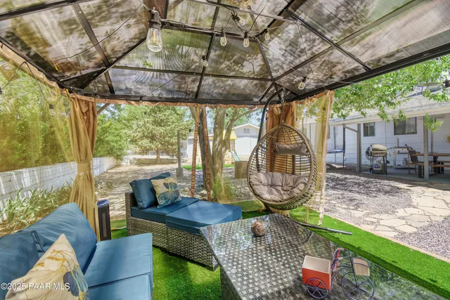 a view of a porch with furniture