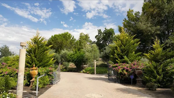 a view of a garden with a fountain