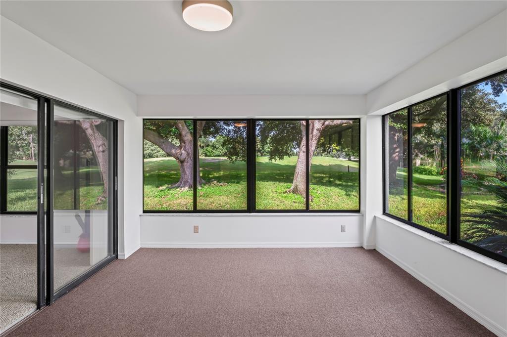 9108 Bassett Lane, Unit B New Port Richey, FL 34655 - Photo 18 of 66 a view of a room with a large window