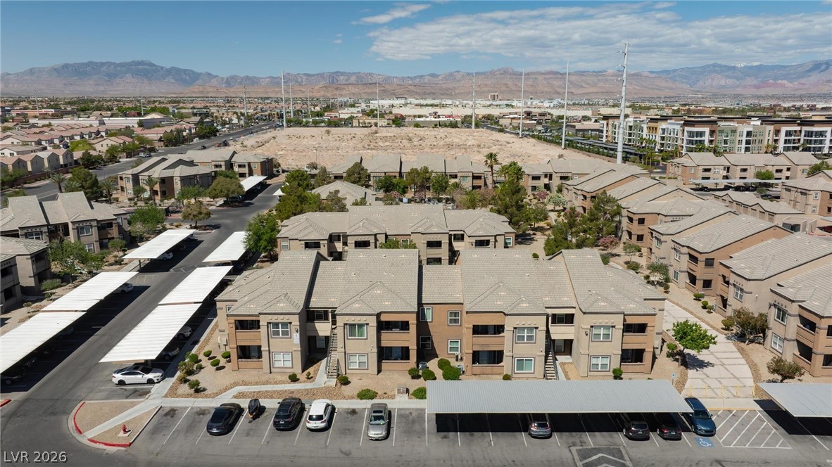 6650 West Warm Springs Road, Unit 2027 Las Vegas, NV 89118 - Photo 29 of 29 An aerial perspective reveals a vibrant community nestled against a backdrop of distant mountains.