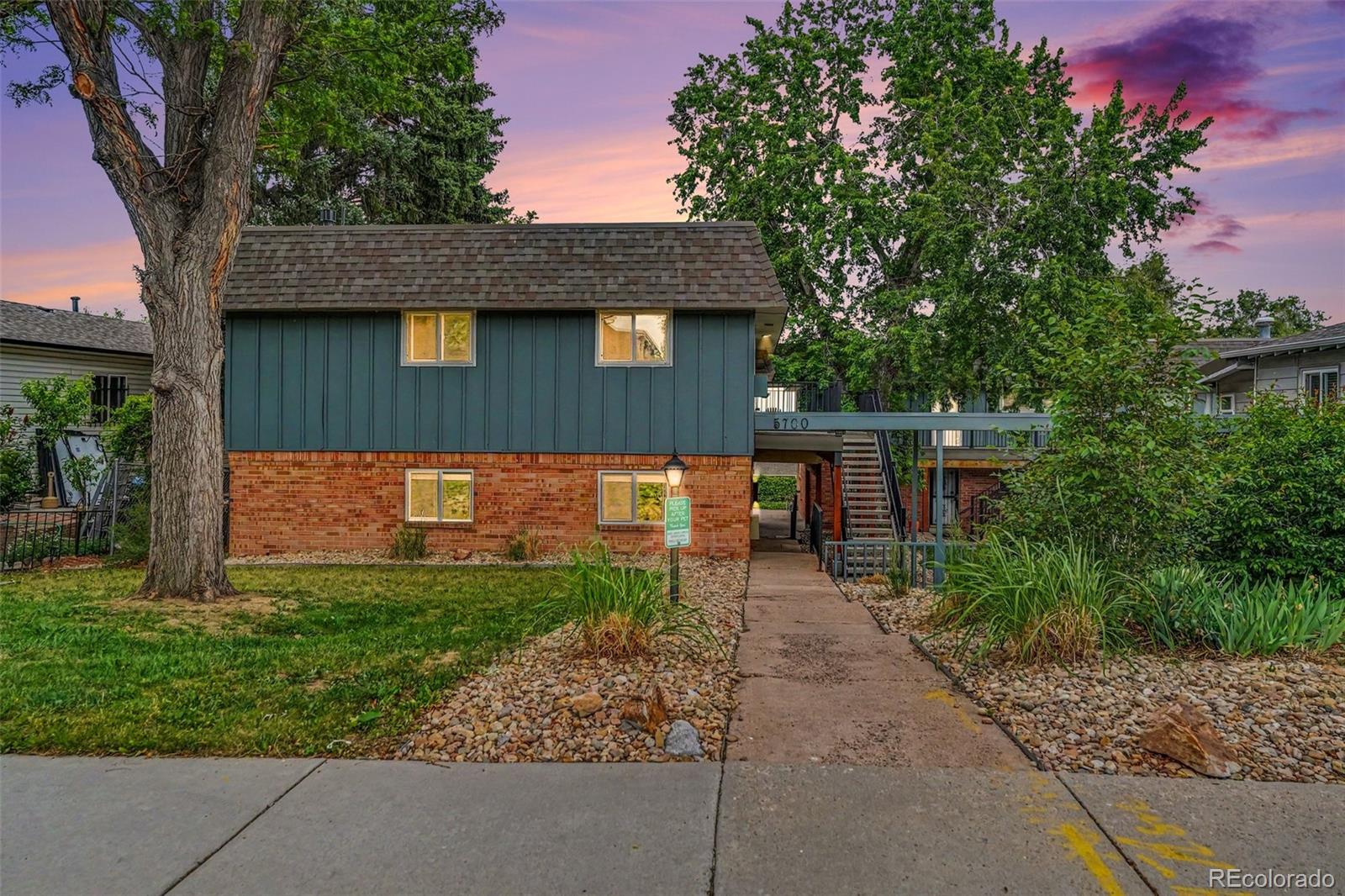 5700 West 28th Avenue, Unit 1 Wheat Ridge, CO 80214 - Photo 18 of 25 a backyard of a house with lots of green space