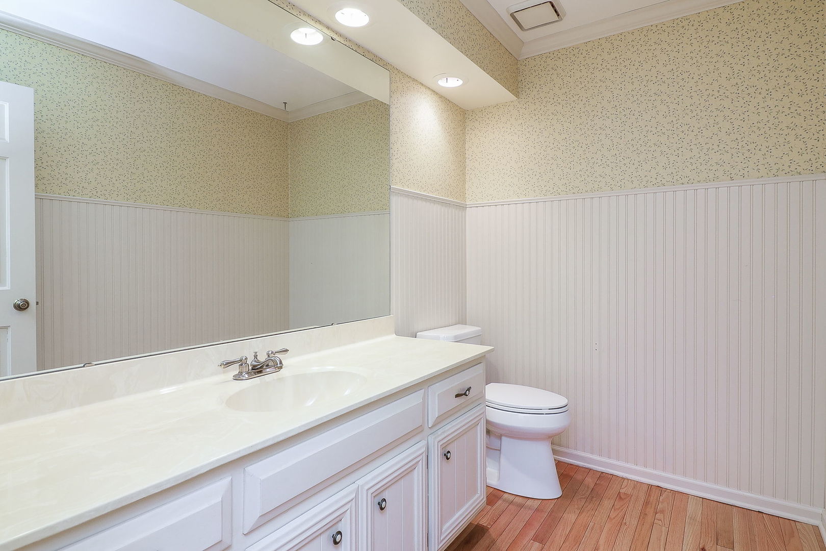 523 Cassin Road Naperville, IL 60565 - Photo 15 of 26 a bathroom with a sink a toilet and a mirror