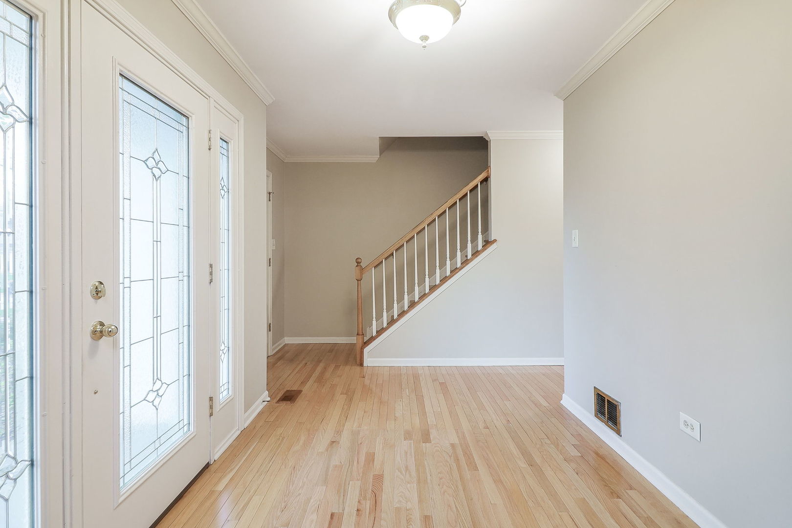 523 Cassin Road Naperville, IL 60565 - Photo 3 of 26 a view of entryway with wooden floor