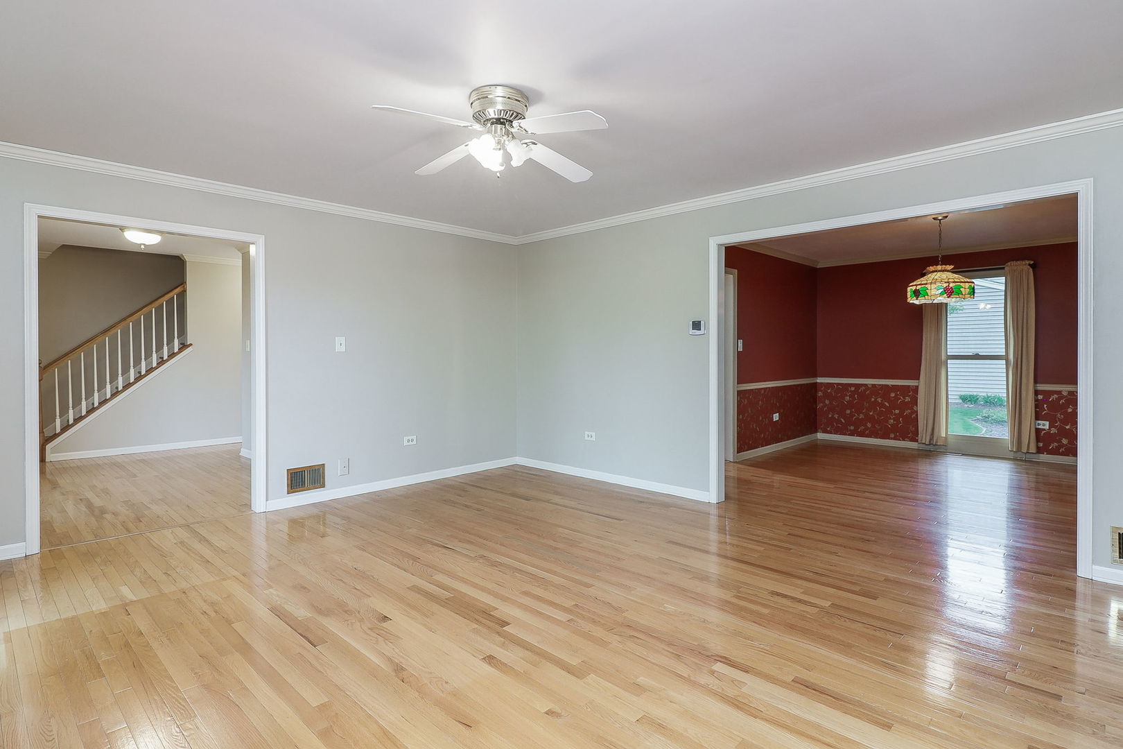 523 Cassin Road Naperville, IL 60565 - Photo 5 of 26 wooden floor in an empty room with a window
