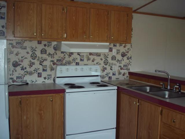 2420 Brookside Road Axton, VA 24054 - Photo 4 of 5 a kitchen with a stove and cabinets