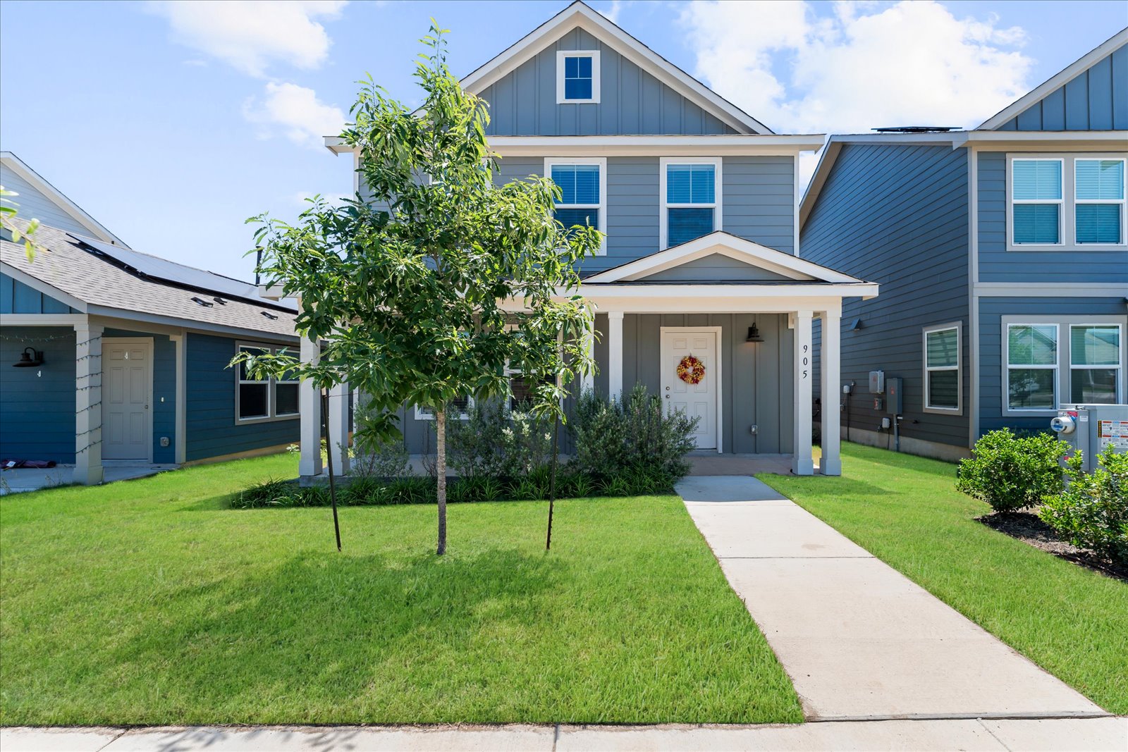 a front view of a house with a yard