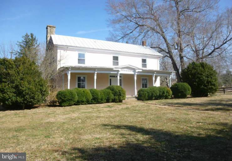 4763 Winchester Road The Plains, VA 20198 - Photo 3 of 12 a front view of a house with a yard