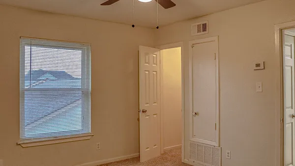 a bathroom with a shower and a glass door