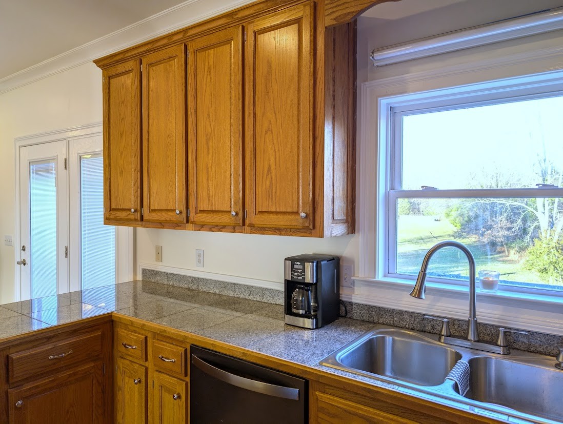 829 Coker Ford Road Portland, TN 37148 - Photo 54 of 63 a kitchen with a window a sink and a cabinets