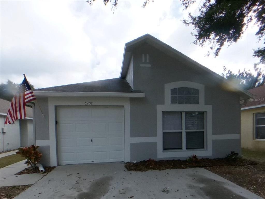 Undisclosed Address Riverview, FL 33578 - Photo 1 of 15 a front view of a house