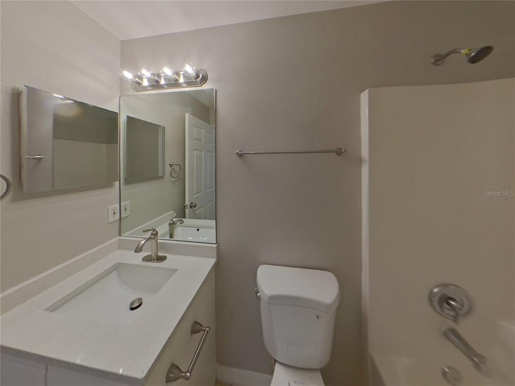 Undisclosed Address Riverview, FL 33578 - Photo 14 of 15 a bathroom with a sink a toilet and shower