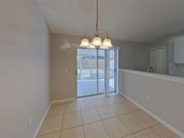 a kitchen with wooden cabinets and a stove top oven