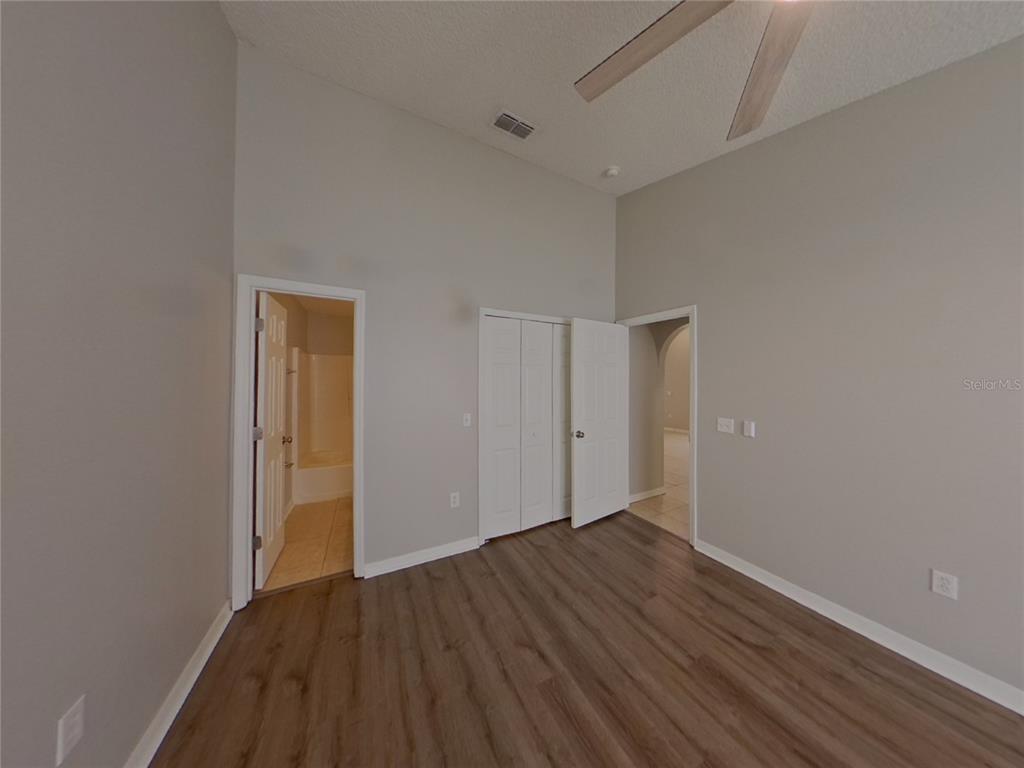 Undisclosed Address Riverview, FL 33578 - Photo 7 of 15 a view of an empty room with wooden floor