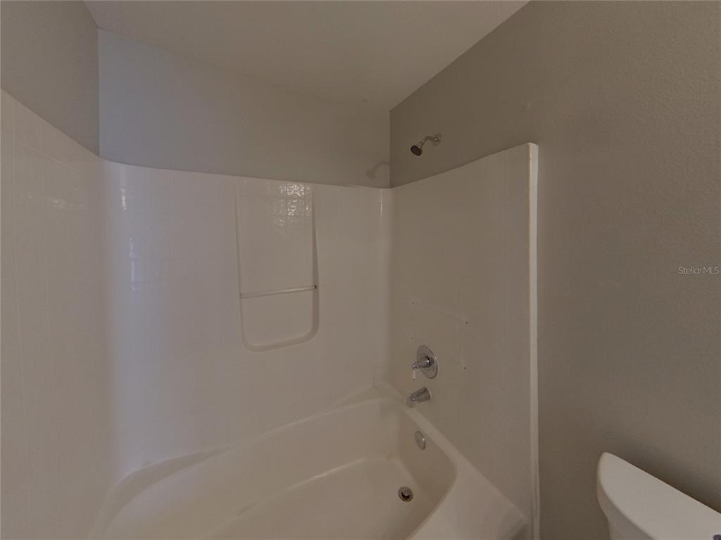 Undisclosed Address Riverview, FL 33578 - Photo 9 of 15 a bathroom with a bathtub