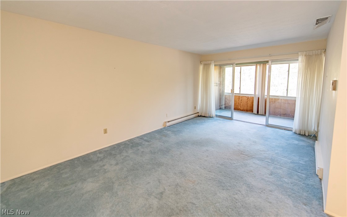 3064 Kent Road, Unit 309A Stow, OH 44224 - Photo 11 of 27 Sliding doors to sunroom ahead