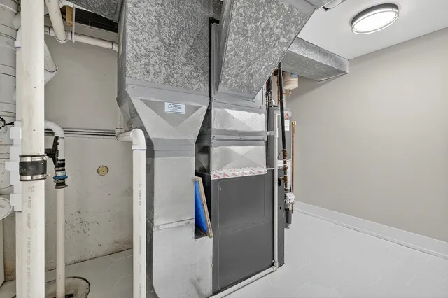 a bathroom with a mirror and a shower