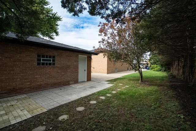 a backyard of a house with lots of green space