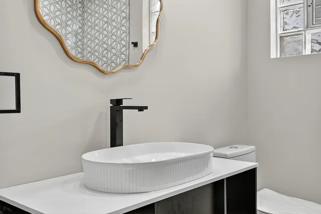 a bathroom with a sink and a mirror