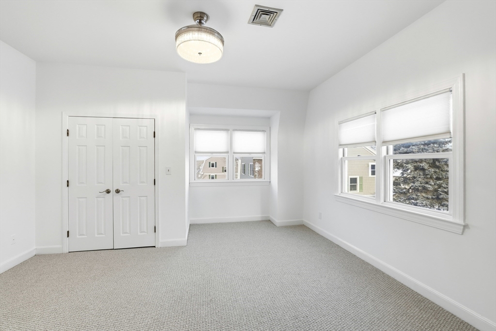 74 Branch Street, Unit 15 Scituate, MA 02066 - Photo 18 of 26 a view of an empty room with a window
